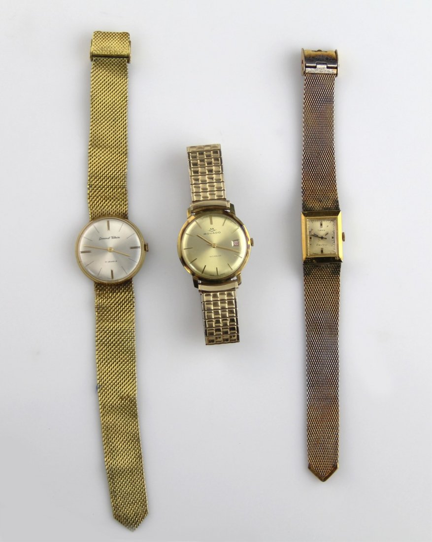 (3) GOLD COLOR VINTAGE WATCHES: (3) GOLD COLOR VINTAGE WATCHES Includes: Men's Germinal Voltaire, men's Movado, and ladies Timex.