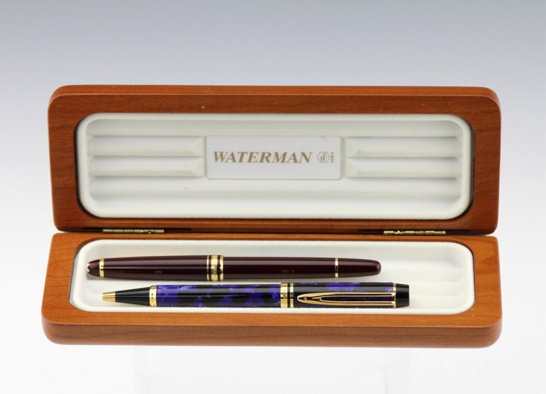 (2) WATERMAN & MONT BLANC PENS: (2) WATERMAN & MONT BLANC PENS Two professional pens. Waterman is marbled blue and black with gold color details and a ball point Waterman ink cartridge. Mont Blanc Meisterstuck is garnet color with g