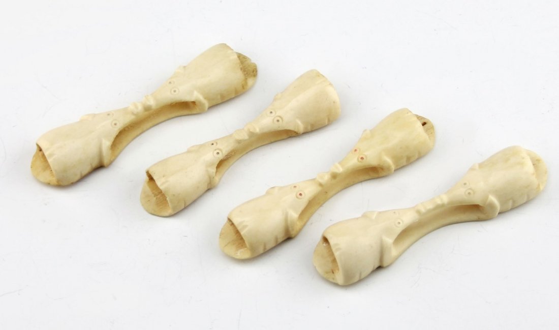 (4) BONE NAPKIN RINGS ELEPHANT MOTIF: (4) BONE NAPKIN RINGS ELEPHANT MOTIF Four carved bone napkin rings, elephant motif. Weight: 98.3 g Size: 4.25"