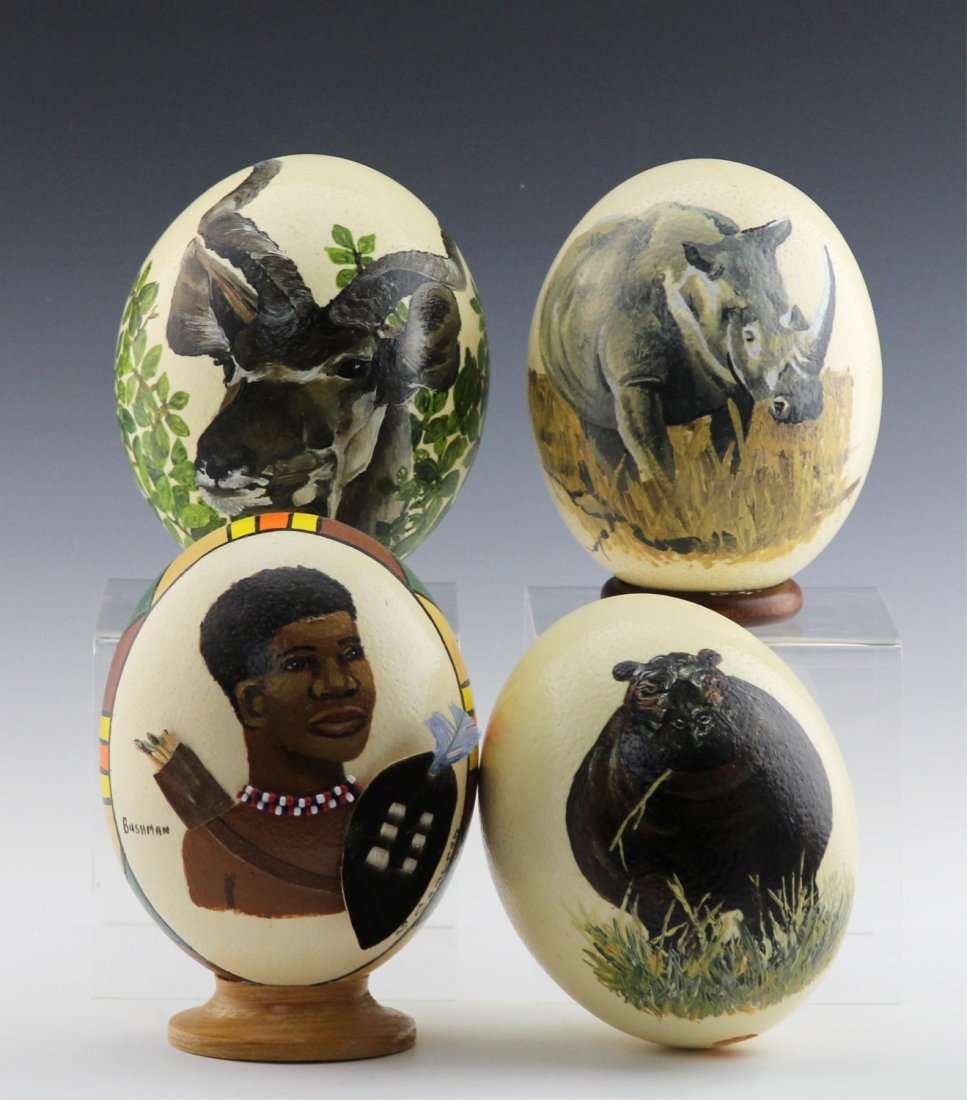 (4) AFRICAN HAND-PAINTED OSTRICH EGG SHELLS: (4) AFRICAN HAND-PAINTED OSTRICH EGG SHELLS A lot of four ostrich egg shells, painted with African wildlife and imagery.