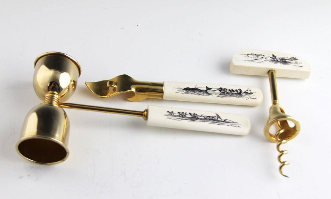 IVORY HANDLED SCRIMSHAW BAR SET SIGNED: IVORY HANDLED SCRIMSHAW BAR SET SIGNED Ivory handled bar set with scrimshaw. Set includes jigger, cork screw, bottle/can opener. Alaskan motifs, signed. Weight: 220.5 g Size: 2.5 - 7.5"