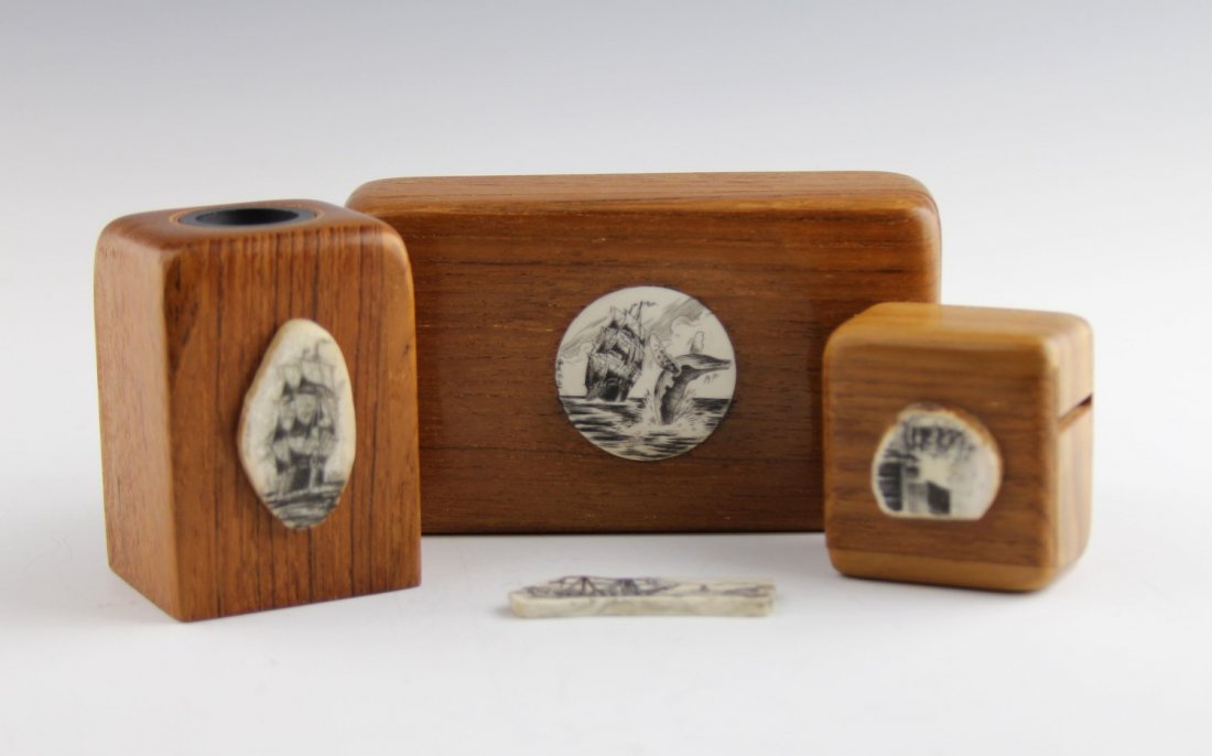 SCRIMSHAW AND WOOD DESK SET: SCRIMSHAW AND WOOD DESK SET Wooden desk set with scrimshaw accents, all in nautical theme. Paper clip holder, stamp holder and box with sliding top. Also included is loose scrimshaw. Weight: 254 g Siz
