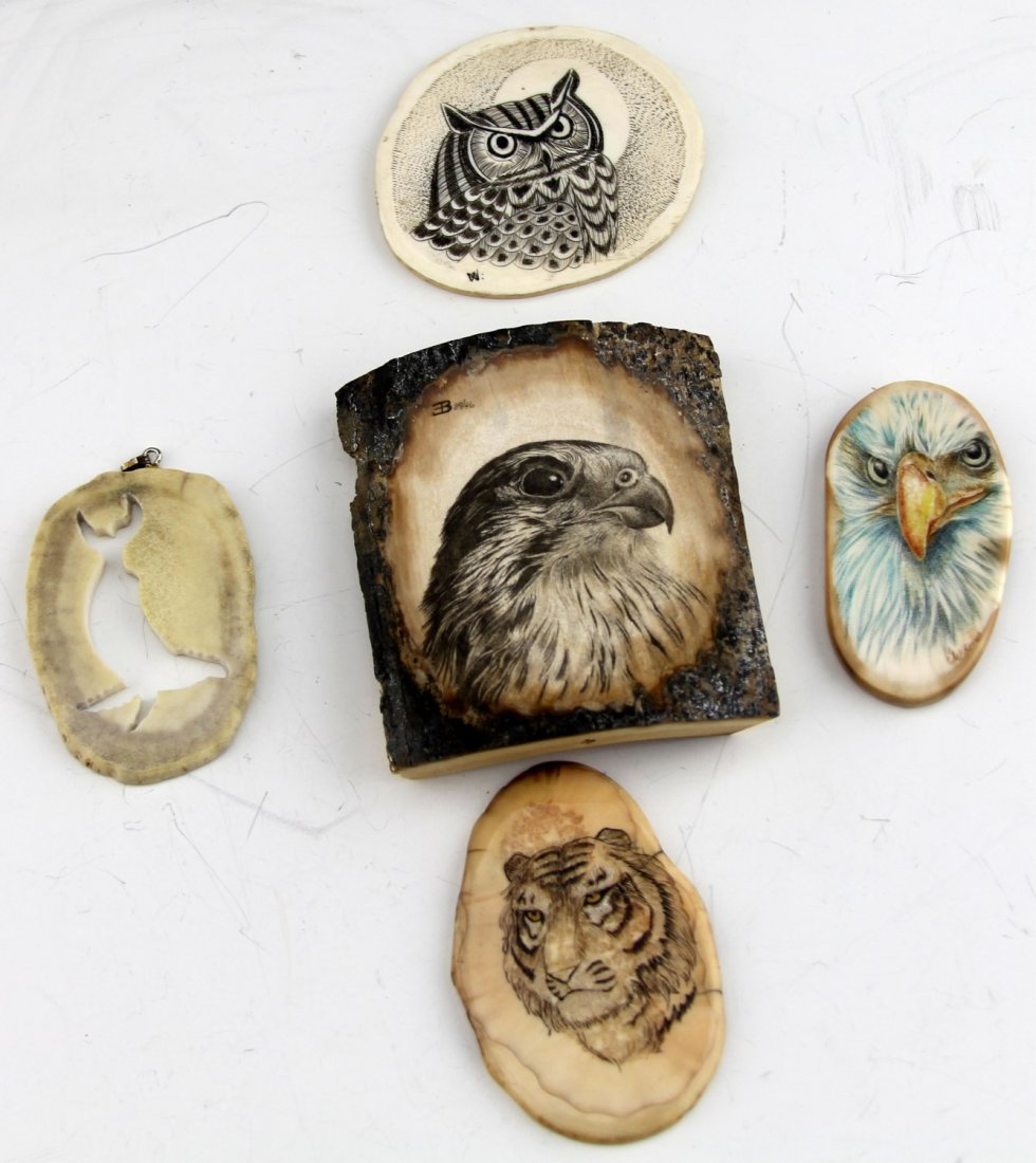 (5) FOSSILIZED WALRUS & MAMMOTH IVORY SCRIMSHAW: (5) FOSSILIZED WALRUS & MAMMOTH IVORY SCRIMSHAW Lot of five fossilized ivory pieces with animal theme scrimshaw; Includes mammoth ivory with falcon and owl and three walrus ivory with eagle, tiger, an