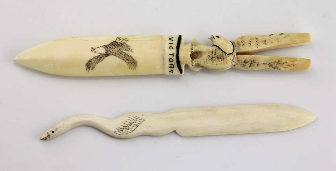 (2) WALRUS IVORY BIRD MOTIF LETTER OPENERS: (2) WALRUS IVORY BIRD MOTIF LETTER OPENERS Lot of two; Includes walrus ivory letter opener with figural eagle finial and scrimshaw details, 7.5", reads "victory"; and the other with figural swan handl