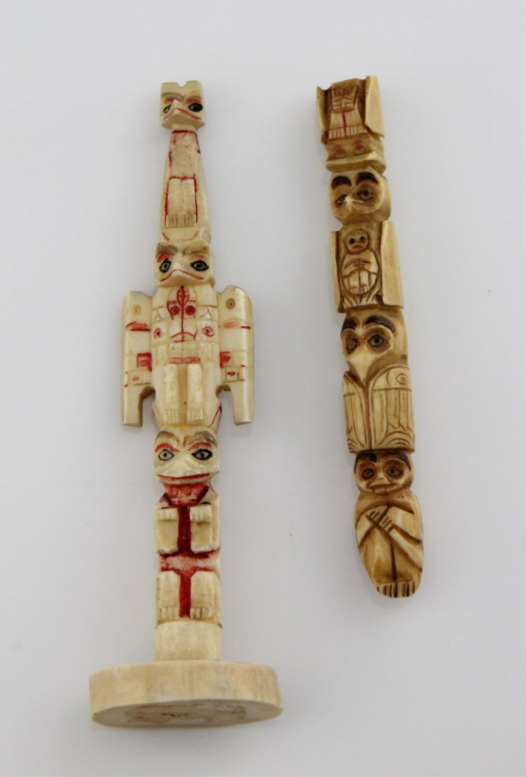 NORTH AMERICAN CARVED WALRUS TOTEM POLES: NORTH AMERICAN CARVED WALRUS TOTEM POLES Lot of two North American carved walrus ivory totem poles, one includes base. Stained to enhance details. Weight: 33.9g total Size: 3.5" - 4.25"