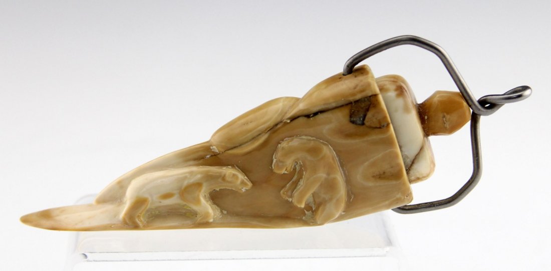 FOSSILIZED WALRUS IVORY LIDDED VESSEL PENDANT: FOSSILIZED WALRUS IVORY LIDDED VESSEL PENDANT Fossilized walrus ivory lidded vessel pendant with relief of walrus and sparring polar bears on reverse. Weight: 56g Size: 5"
