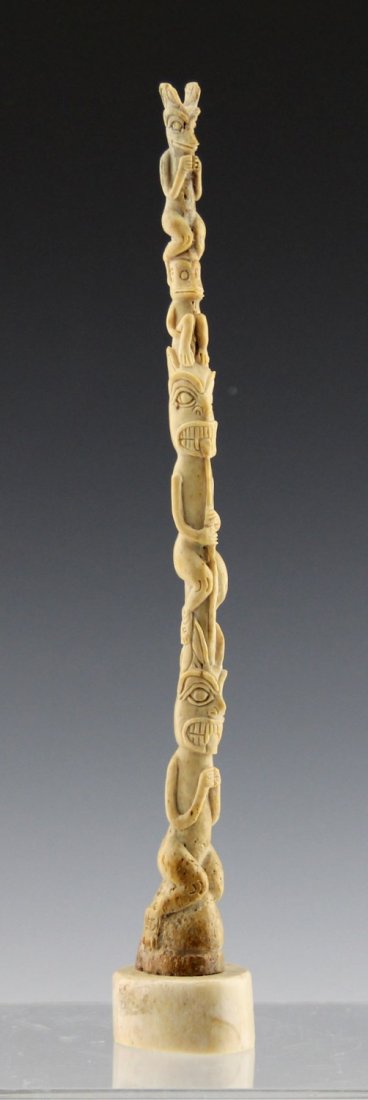 9.5" ALASKAN CARVED WALRUS OOSIK TOTEM POLE: 9.5" ALASKAN CARVED WALRUS OOSIK TOTEM POLE Alaskan carved walrus oosik totem pole carving. Mounted to walrus ivory base. Weight: 65.9g total Size: 9.5"