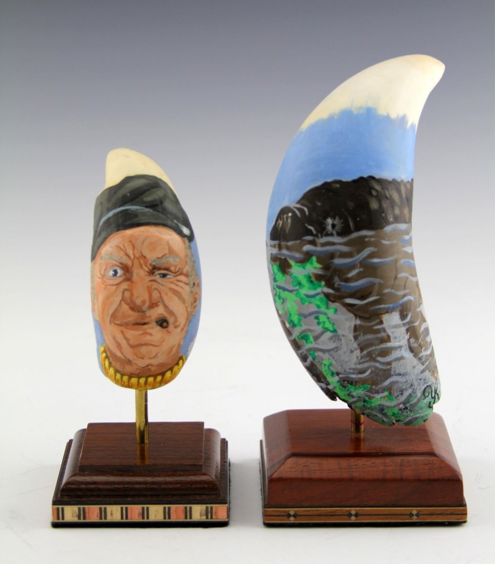 (2) PAINTED IVORY WHALE TOOTH MANATEE & PORTRAIT: (2) PAINTED IVORY WHALE TOOTH MANATEE & PORTRAIT Lot of two painted ivory whale teeth; Include manatee, 7" including base, and a portrait of smoking man, 5.5" including base. Weight: 559.9g total incl