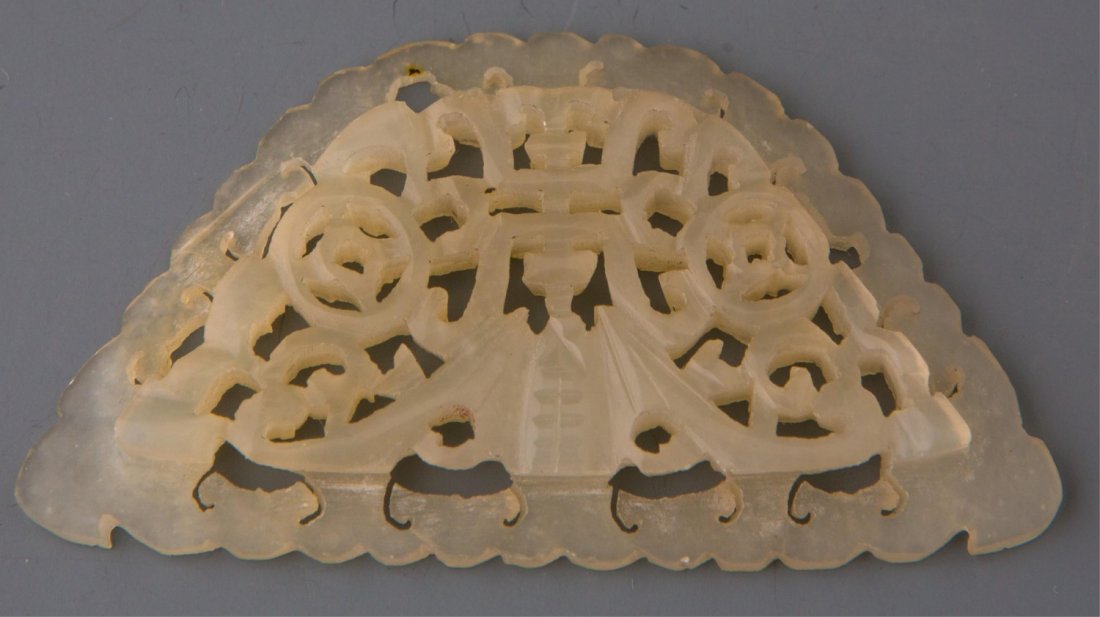 CHINESE CARVED WHITE JADE BAT PLAQUE: CHINESE CARVED WHITE JADE BAT PLAQUE Chinese carved open-work white jade plaque decorated with scrolling bat motif. Weight: 7.8g Size: 2.25 x 1.25"