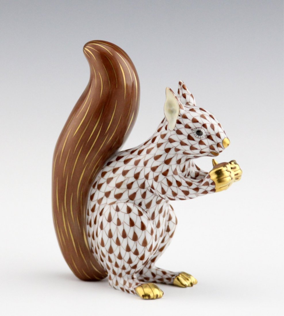 HEREND PORCELAIN SQUIRREL CHOCOLATE FISHNET: HEREND PORCELAIN SQUIRREL CHOCOLATE FISHNET Herend hand-painted porcelain seated squirrel in chocolate fishnet. Marked on underside. Size: 4.5"