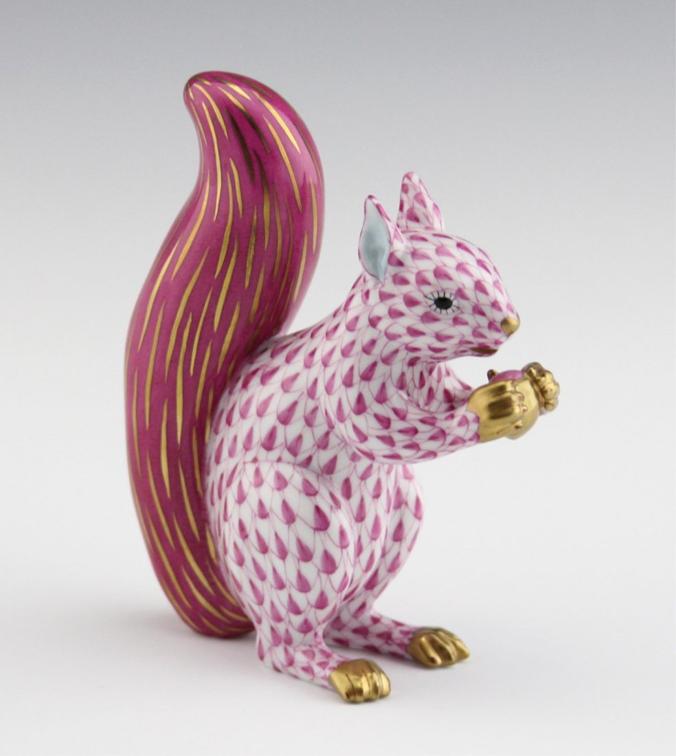 HEREND PORCELAIN SQUIRREL RASPBERRY FISHNET: HEREND PORCELAIN SQUIRREL RASPBERRY FISHNET Herend hand-painted porcelain seated squirrel in raspberry fishnet. Marked on underside. Size: 4.5"