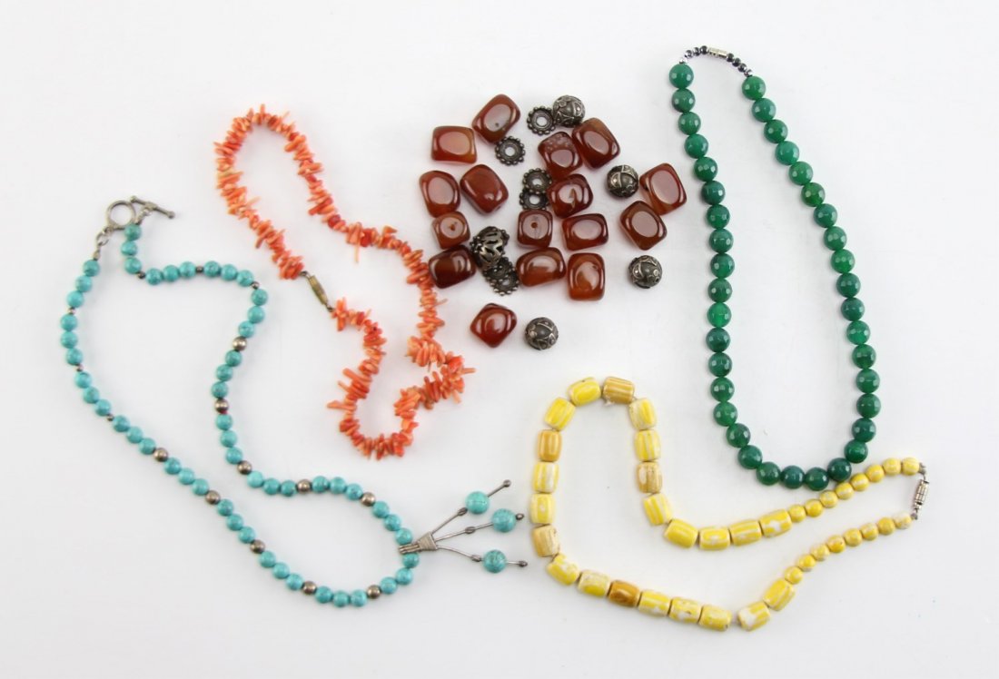 (5) COSTUME JEWELRY NECKLACES & BEADS: (5) COSTUME JEWELRY NECKLACES & BEADS Lot includes four necklaces; coral (composite), ivory (composite), faceted jade (dyed), and turquoise. Also includes (1) group of silver and carnelian beads. Weig