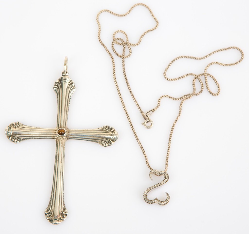 (2) STERLING SILVER OPEN HEART & CROSS PENDANT: (2) STERLING SILVER OPEN HEART & CROSS PENDANT Two pieces of sterling silver jewelry. Includes open heart pendant with diamonds on 20" chain, and a sterling silver cross pendant set with single tiger'
