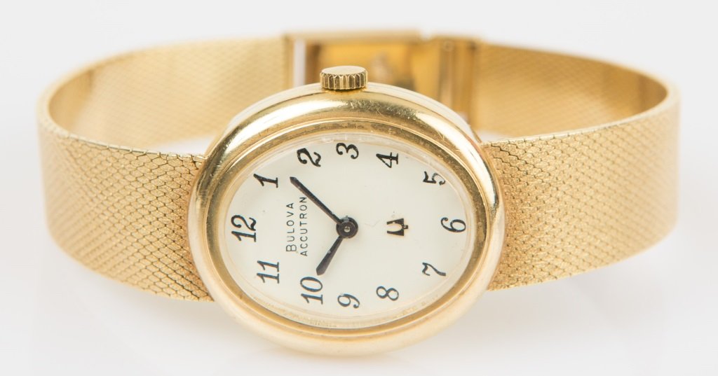 LADIES 1973 BULOVA ACCUTRON 14K GOLD WRIST WATCH: LADIES 1973 BULOVA ACCUTRON 14K GOLD WRIST WATCH Ladies 1973 Bulova Accutron with 14K yellow gold band and case. Case #43397. Case measures 17.6mm x 21.5mm and 3.4mm thick. Battery operated. Weight: 3
