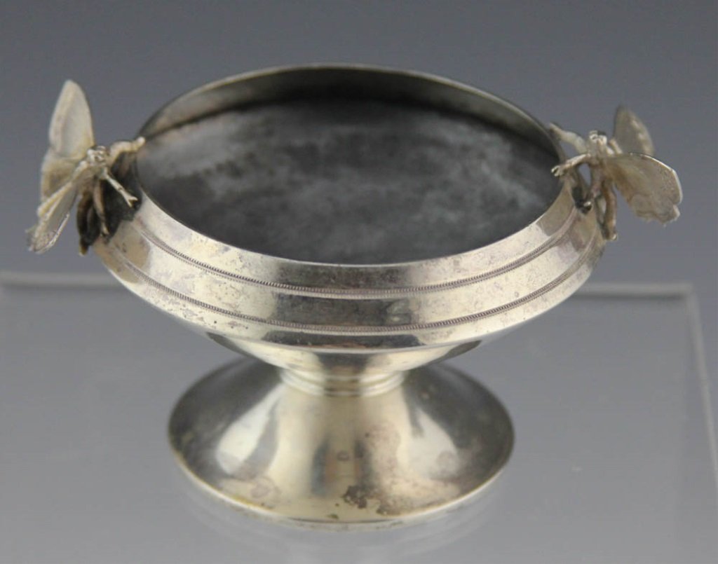 STERLING SILVER SALT CELLAR WITH MOTH MOTIF: STERLING SILVER SALT CELLAR WITH MOTH MOTIF Sterling silver salt cellar with moth motif and British hallmarks indicated it was made in Birmingham, England in 1830. Weight: 2 ozt Size: 3.5 x 2"