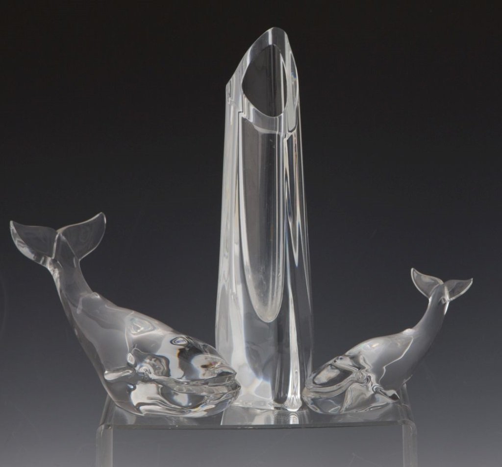 BACCARAT CRYSTAL WHALES & VASE: BACCARAT CRYSTAL WHALES & VASE Baccarat whale figurines and flower vase. Includes one smaller whale (6"), one larger whale (9") and a bud vase (9").