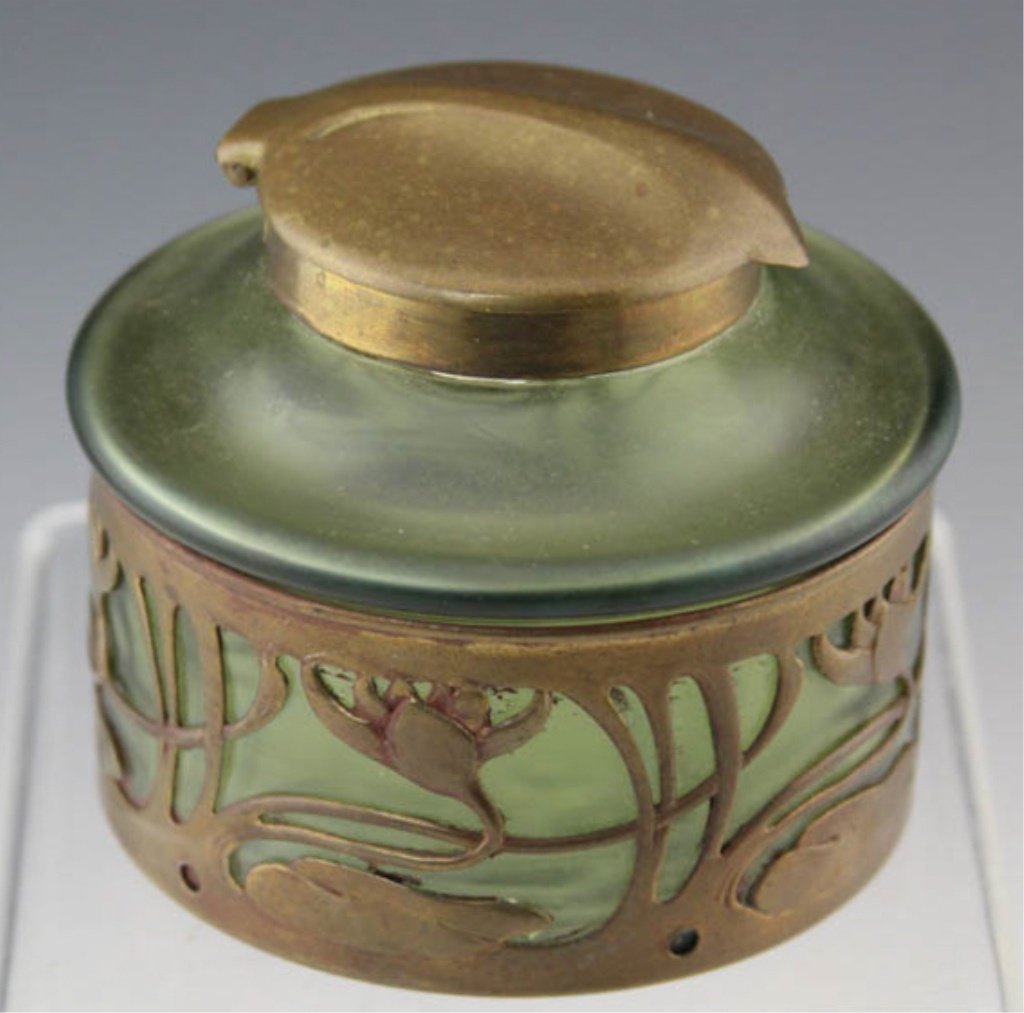 LOETZ ART NOUVEAU BRONZE & GLASS INKWELL UNSIGNED: LOETZ ART NOUVEAU BRONZE & GLASS INKWELL UNSIGNED Loetz Art Nouveau green glass inkwell with bronze overlay, unsigned. Size: 2.75 x 3 (diameter)"