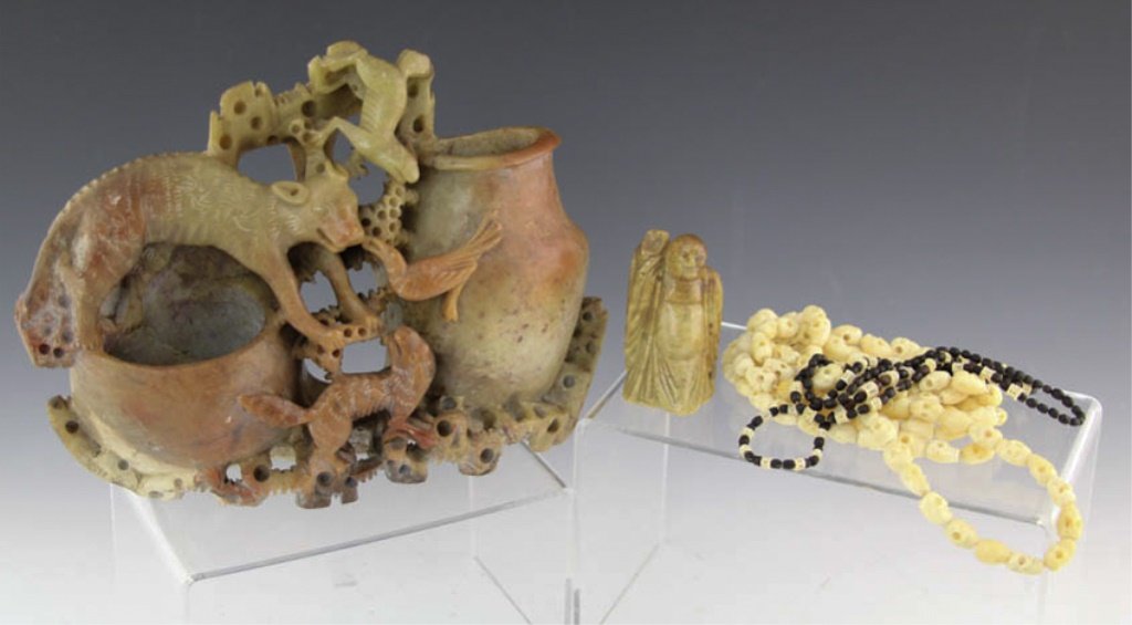 MIXED COLLECTIBLE SOFTSTONE & BONE ITEMS: MIXED COLLECTIBLE SOFTSTONE & BONE ITEMS Lot of mixed softstone and bone collectible items. Includes a carved softstone boulder (9 x 7"), small softstone Buddha figure (2.5"), beaded skull carved bone