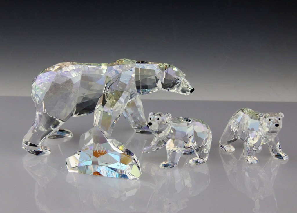 SWAROVSKI SCS POLAR BEAR FIGURINES: SWAROVSKI SCS POLAR BEAR FIGURINES Swarovski SCS polar bear figurines. Includes: "Polar Bear Cubs Cry Moonlight", and "Siku Polar Bear." Both in original boxes.