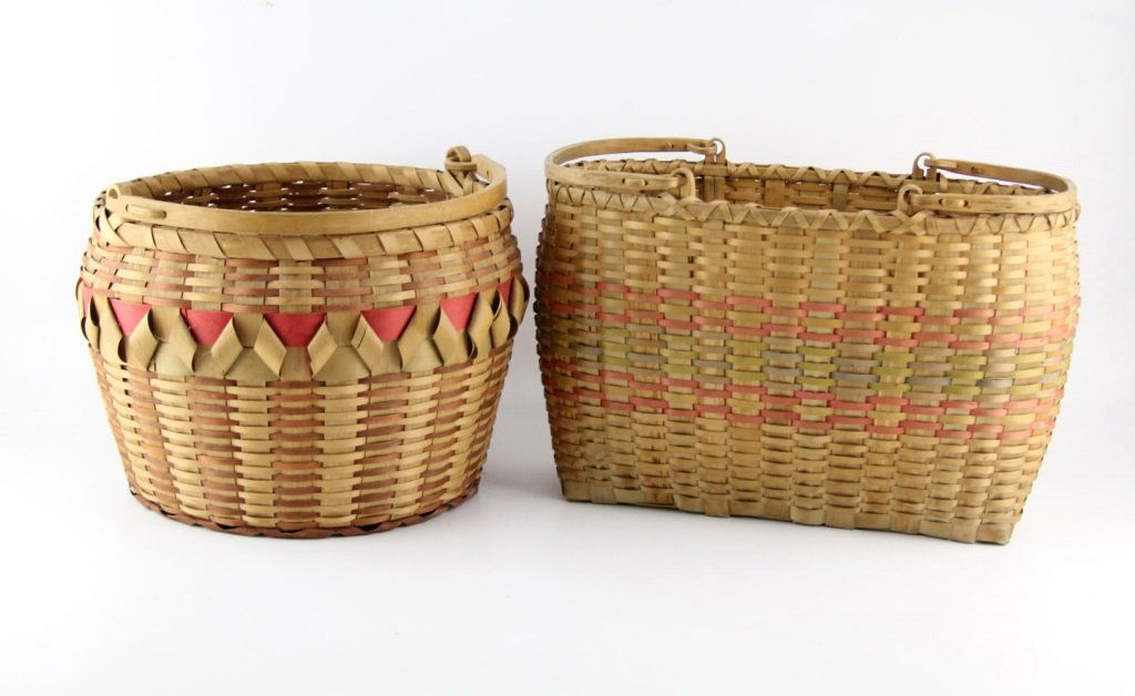 PAIR OF CHEROKEE HANDMADE BASKETS: PAIR OF CHEROKEE HANDMADE BASKETS Pair of Cherokee handmade baskets, circa 20th century, made from poplar and oak. Both have hand carved, oak, swing handles, and vegetable dyed stripes. Sizes are 10 x
