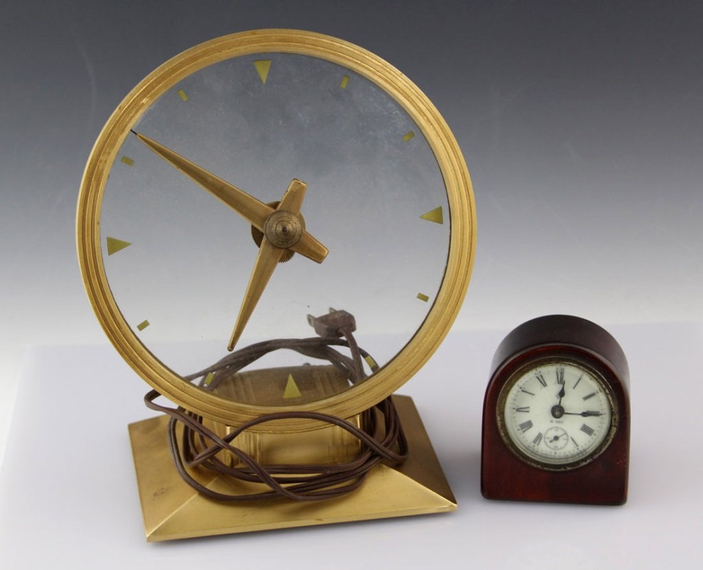 ANSONIA 8 DAY CLOCK & HADDON GOLDEN VISION CLOCK: ANSONIA 8 DAY CLOCK & HADDON GOLDEN VISION CLOCK Lot of two, to include an Ansonia Clock Co. 8 Day travel clock (3.25 x 3"), and a mid-century Haddon Golden Vision Electric Clock (10 x 8").