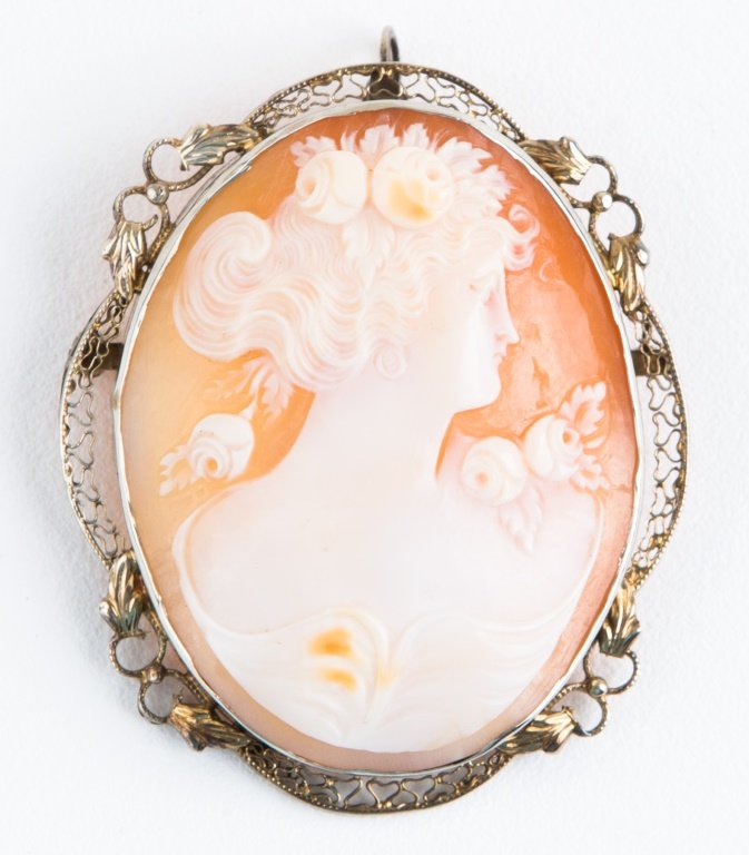 LADIES 14K WHITE GOLD CAMEO BROOCH PENDANT: LADIES 14K WHITE GOLD CAMEO BROOCH PENDANT Ladies 14K white gold filigree brooch pendant with a 30 x 38mm shell cameo. Weight: 9.6g Size: 37 x 44mm