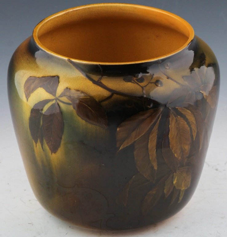 ROOKWOOD POTTERY JARDINIERE 1892: ROOKWOOD POTTERY JARDINIERE 1892 Decorated by Anna M. Valentien, having standard glaze with leaves and berries on a brown and green ground, marks include impressed Rookwood flame logo indicating date 