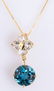 10K YELLOW GOLD BLUE, WHITE TOPAZ PENDANT NECKLACE