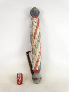 19th c. Barber Pole: 19th c. polychrome painted wooden barber pole with original iron bracket. 34 1/2" L..