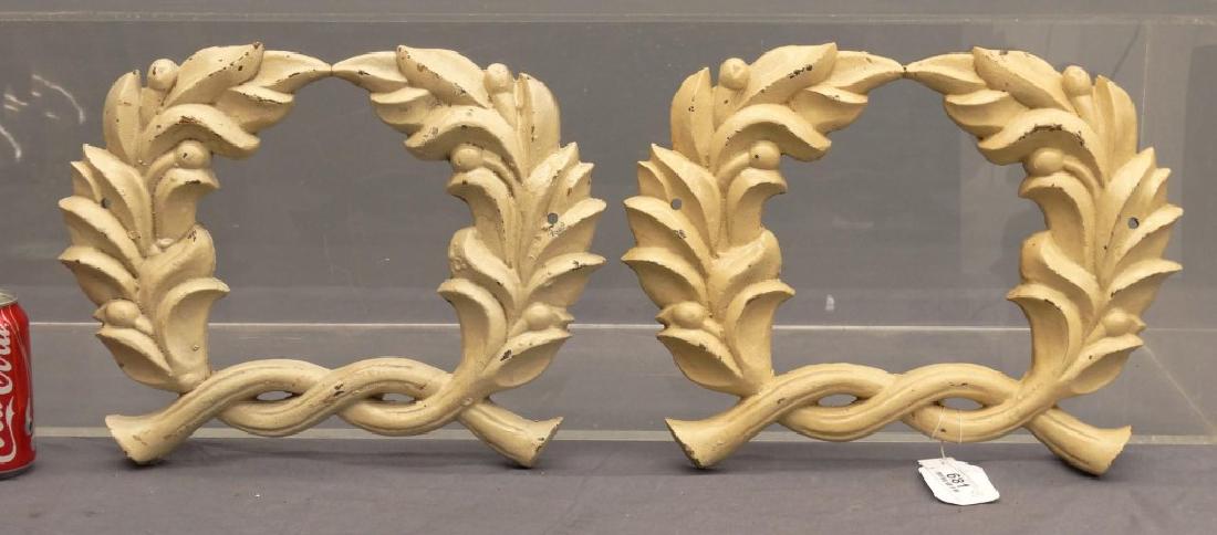 Cast Iron Wreaths: Pair of cast iron wreaths. 15" x 12".