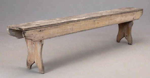 19th c. Bench: 19th c. bootjack bench in old surface. 78" x 9 1/2"x 18" Ht..