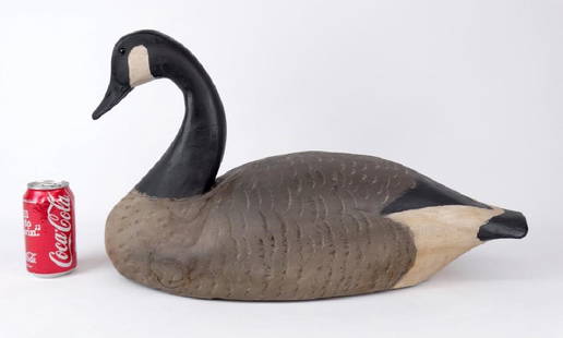 Canada Goose Decoy: Polychrome painted wooden Canada goose decoy. Impressed underside "CM". Written underside "Carved By Cork Mcgee....VA/1983". 23" L., 14 1/2" Ht..