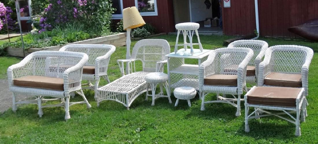 Wicker Lot: Twelve piece wicker set. Includes lamp, tables, settees, chairs etc..