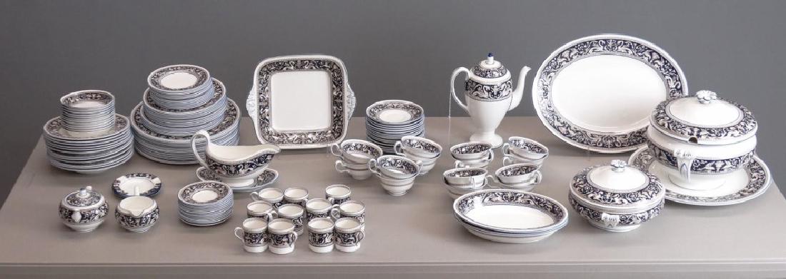 Wedgwood Dinner Service: Wedgwood "Florentine" bone china dinner service. Includes (12) 10 3/4" plates, (12) 8 1/4" plates, (12) 8" soups, (12) 6" plates, (12) 5" berry bowls, (14) coffee cups and saucers, covered sugar & cre