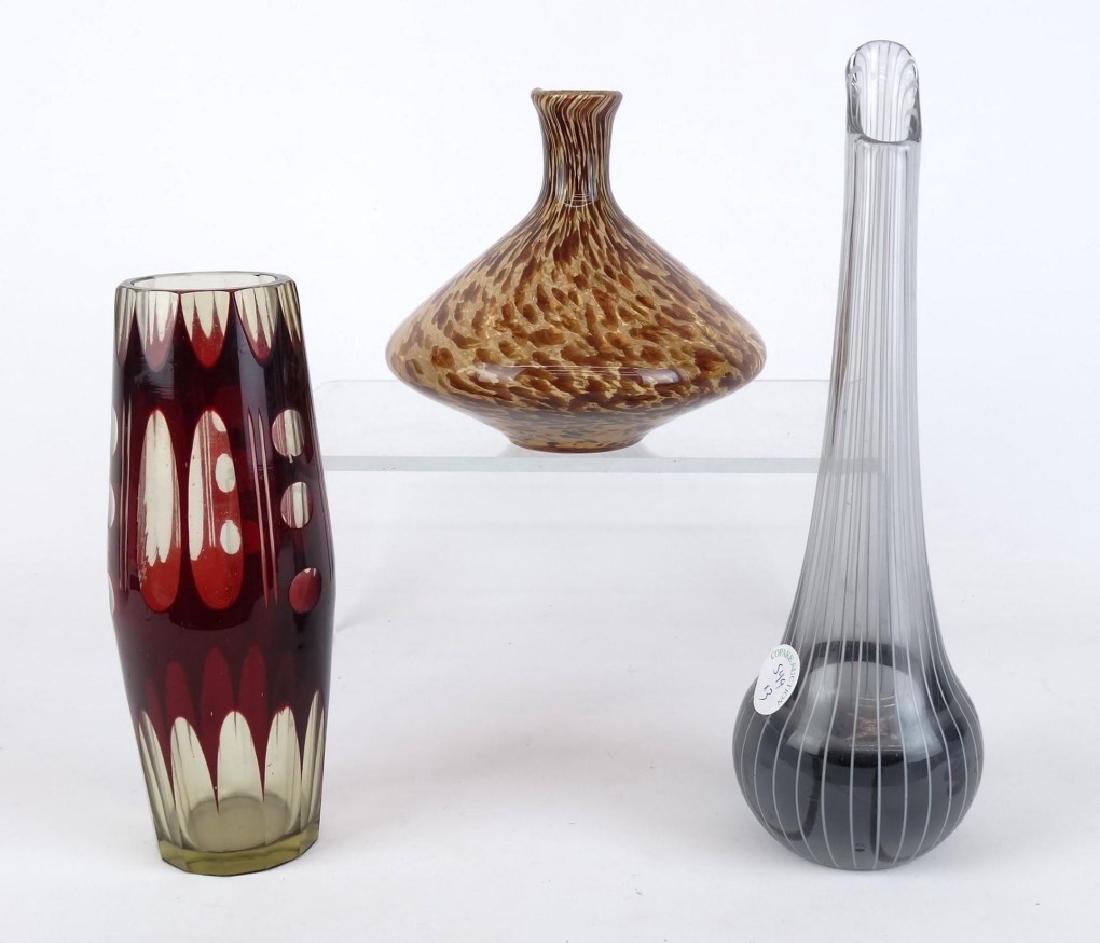 Glassware Lot: Lot (3) pieces including Modernist Czech vase, early 20th c., cased ruby-pale green glass with cut geometric designs (8" Ht.), MCM Venetian smoke glass vase (11" Ht.), and speckled tortoise glass angu