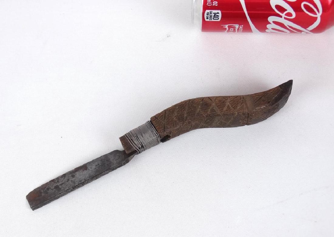 Crooked Knife: Early crooked knife with carved stylized hand. 9" L..