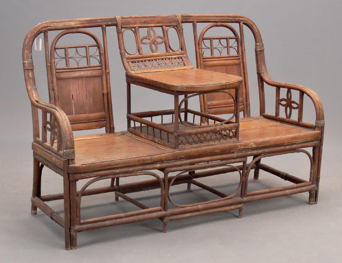 Bamboo Settee: C. 1900's bamboo settee. 52" W..