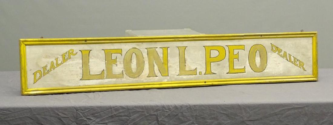 Trade Sign: Trade sign, painted wooden "Dealer Leon L. Peo.". Three color. 9" x 53 3/4".