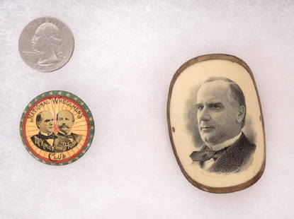 William McKinley Campaign Items: Lot (2) William McKinley Campaign items. Includes celluloid portrait head badge and a pinback of the National Wheelman’s Club". Good condition. Case included.