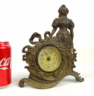 Cast Iron Figural Clock: C. 1890's "Columbian" cast iron figural mantle clock. 9 1/2" Ht." Ht.. Marked reverse Sears Roebuck & Co..