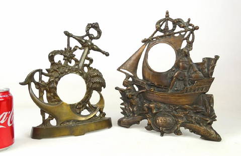 Cast Iron Clock Frames: Lot (2) cast iron clock frames. Includes 1892 Columbian Exposition (Columbus with Native Americans), and anchor. 11" and 12" Ht..