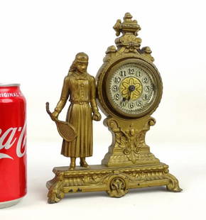 Figural Tennis Player Clock: C. 1890's cast metal figural tennis player mantle clock. 8 1/4" Ht..