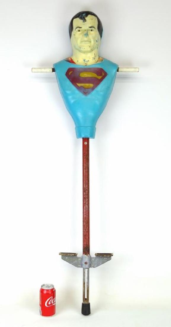 Vintage Superman Pogo Stick: Vintage Superman pogo stick. 48" L.. Marked D. C. Comics 1977.