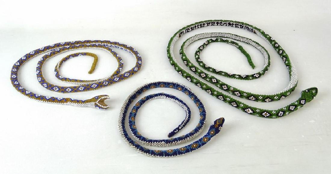 Prisoner Art Lot: Lot (3) beaded Turkish prison art snakes. (1) 1918, (2) 1919. 75" L., 43" L., 97" L..