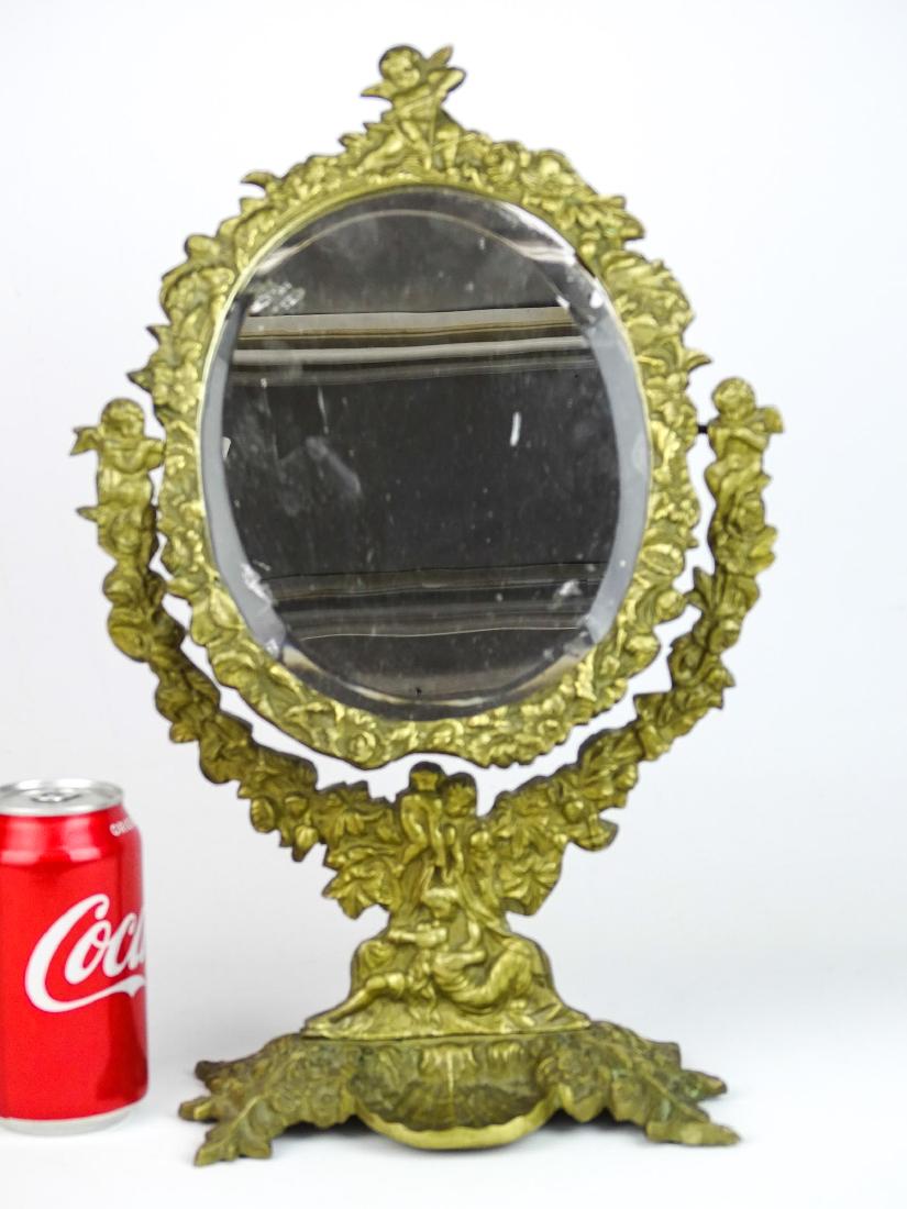 Brass Vanity Mirror: Brass vanity mirror. 16" Ht..