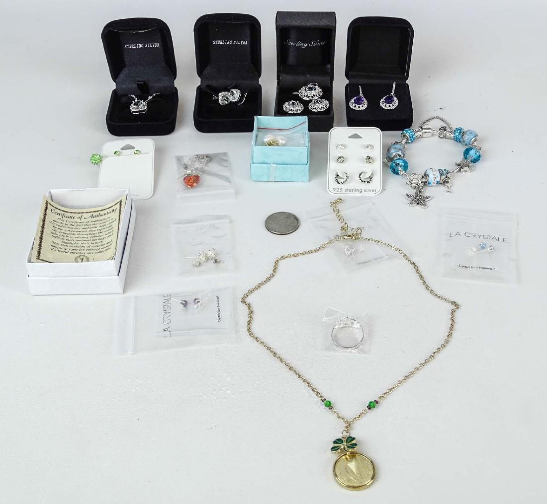 Jewelry Lot: Misc. new jewelry lot including heart charm pendant set, Swarovski aquamarine sterling earrings, green amethyst pendant, 5.20 carat amethyst sterling earrings, topaz pendant with earrings, misc. sterl