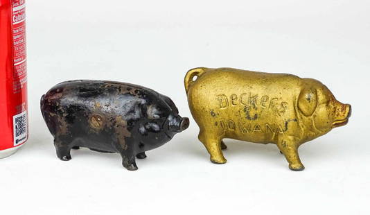 Still Banks: Lot (2) early cast iron pig still banks. Includes "DECKER'S IOWANA" (4" W., 2 1/2" Ht.), the other in old black paint (4" W.).