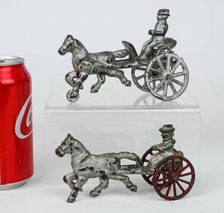 Cast Iron Horse Drawn Cart Toys: Lot (2) C. 1900 cast iron horse drawn cart toys. 5" L..