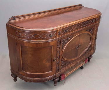 Sideboard: Large C. 1900's sideboard. (4) doors, (3) drawers. 70" x 24" x 40".