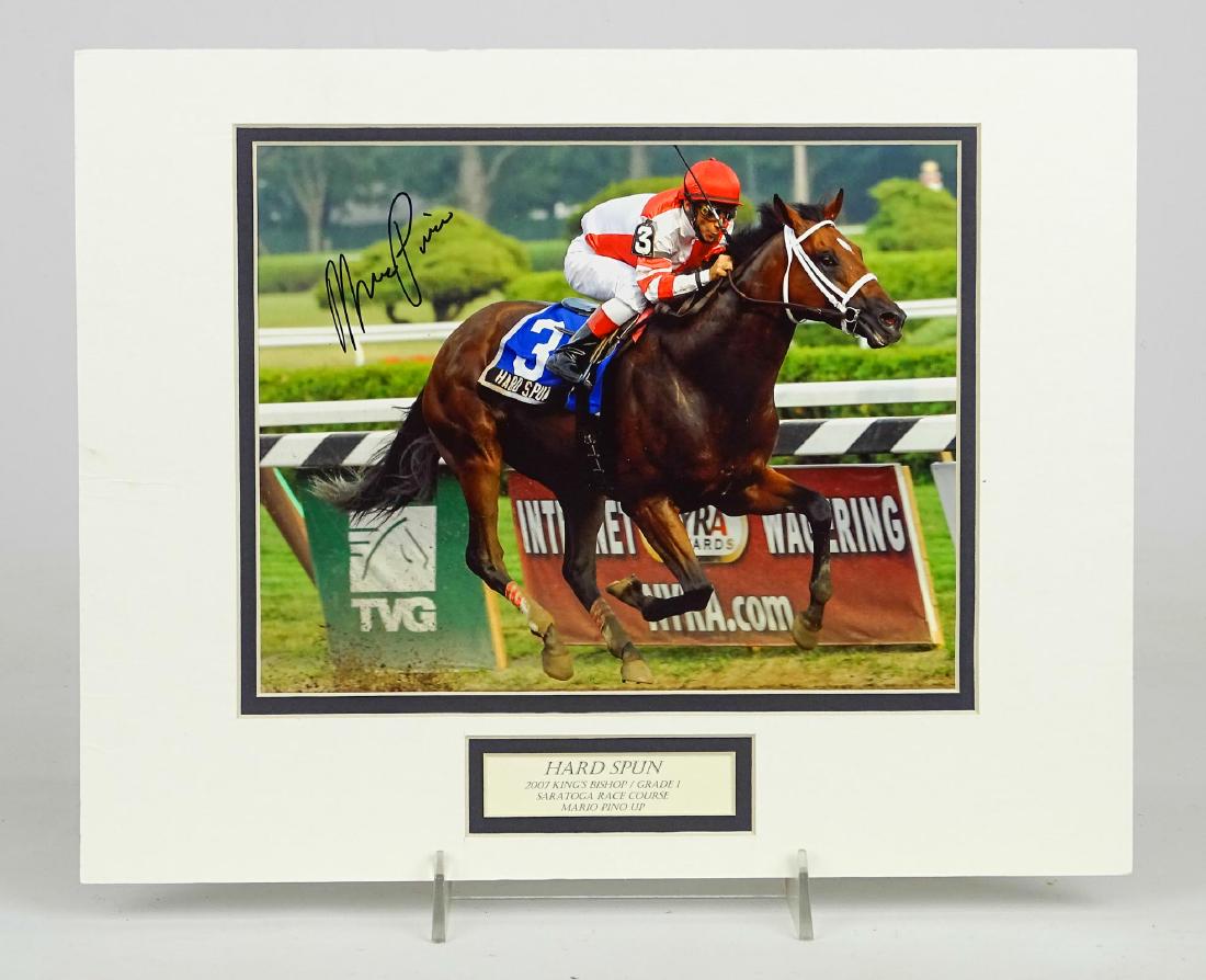 Mario Pino Autographed Horse Racing Photograph: Mario Pino autographed horse racing photograph. Overall 11" x 14".